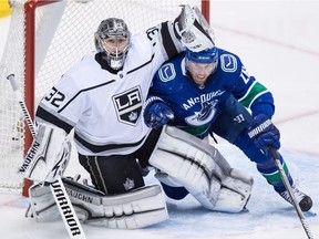 Thomas Vanek, second on the Vancouver Canucks 14 goals and 21 assists, gets a pat on the head from Los Angeles Kings' goalie Jonathan Quick.