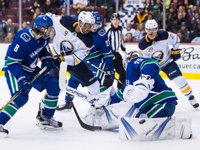 Jacob Markstrom holds the fort as the Sabres press for another goal Thursday.