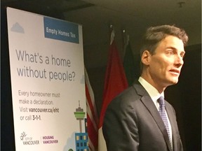 Vancouver Mayor Gregor Robertson provides an update on the new empty homes tax Monday at city hall.