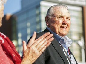 In this Sept. 13, 2014, file photo, Washington State alumnus Keith Jackson smiles after raising the Cougar flag before the start of an NCAA college football game against Portland State at Martin Stadium in Pullman, Wash. (AP Photo/Dean Hare, File)