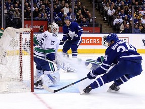 Auston Matthews of the Toronto Maple Leafs scores on Jacob Markstrom of the Vancouver Canucks during NHL action at the Air Canada Centre in Toronto on Sunday January 7, 2018. Dave Abel/Toronto Sun/Postmedia Network