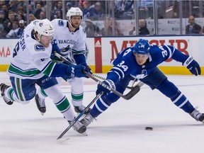 Vancouver Canucks rookie Brock Boeser unleashes a shot past defending Toronto Maple Leafs star — and last season’s Calder Trophy winner — Auston Matthews during an NHL game earlier this month at Toronto’s Air Canada Centre.