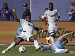 Sam Adekugbe tackles David Villa in an April, 2016 game against NYCFC. It would be the last time the left back was seen in Whitecaps colours.