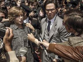 FILE - This image released by Sony Pictures shows Michelle Williams, left, and Mark Wahlberg in TriStar Pictures' "All The Money in the World." After an outcry over a significant disparity in pay with Williams, Wahlberg has agreed to donate the $1.5 million he earned for reshoots on the movie to the anti-sexual misconduct initiative Time's Up, in Williams' name, announced Saturday, Jan. 13, 2018.