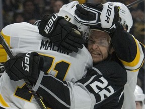 Trevor Lewis of the Los Angeles Kings, right, no stranger to the rough stuff, was Public Enemy No. 1 in Vancouver after his hit on Brock Boeser. Canucks insist they couldn't "get even" with Lewis because his hand was injured.