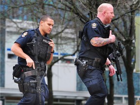 Armed police at B.C. Supreme Court for the bail hearing of Jamie Bacon on Tuesday, Jan. 9. Bacon is charged with one count of counselling to commit murder.