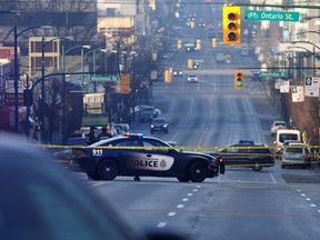 VANCOUVER, BC., January 14, 2018 -- Police on the scene of an overnight shooting on West Broaday Ave and Ontario St in Vancouver, BC., January 14, 2018. Three people were taken to hospital following the shooting at 9:00pm on Saturday evening. (NICK PROCAYLO/PostMedia)  00052010A ORG XMIT: 00052010A [PNG Merlin Archive]