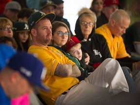 Kyle Losse's family, including, from left, father Brian Losse, stepmom Niki Losse and brother Tyler Losse, listen to speeches as hundreds attended a memorial for Kyle at Winskill Park in Tsawwassen on Jan. 28.