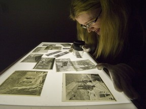 Sun and Province Librarian Carolyn Soltau checks out some of the negatives donated to the Vancouver Archives.
