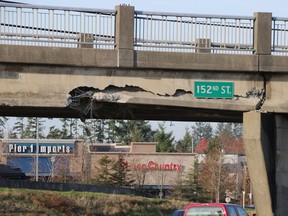A truck with an excavator hit the 152nd Street overpass on Hwy. 99.