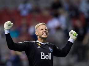 Vancouver Whitecaps' goalkeeper David Ousted celebrates the team's 3-0 victory over Minnesota United during an MLS soccer game in Vancouver, B.C., on Wednesday September 13, 2017.