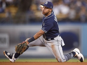 San Diego Padres third baseman Yangervis Solarte holds on to the ball after catching a line drive in Los Angeles, Monday, Sept. 25, 2017.