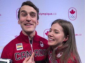 Denny Morrison hugs his wife Josie after the announcement earlier this month in Calgary that they were both named to the Canadian Olympic speed skating team that's going to the Winter Olympics in Pyeongchang, South Korea.