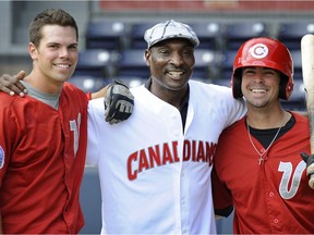 Former Toronto Blue Jays outfielder Lloyd Moseby (centre) in town at Nat Bailey stadium with young Vancouver Canadian players Eli Boike (left) and Bryan Kervin (right) in  2011.