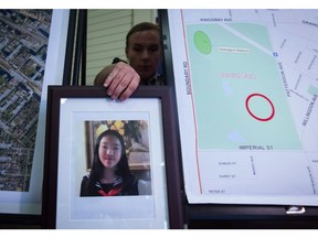 RCMP Cpl. Daniela Panesar places a photo of Marissa Shen, 13, next to a map indicating where her body was found in Central Park, during a news conference in Burnaby, B.C., on Wednesday July 19, 2017. RCMP say the death of a 13-year-old girl found in a park in a Vancouver suburb was a random attack. Marissa Shen's body was found in some brush in Burnaby's Central Park on July 19.