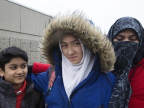 Khawlah Noman and her brother Mohammad Zakarijja (on left), appeared before the media with their mom Saima Samad, (right) to talk about the assault that was said to have happened to Khawlah on their way to Pauline Johnson Public School in Scarborough. Police now say that the incident never happened.