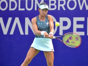 Carol Zhao of Richmond Hill, Ont., hits a return to former world No. 12 Yanina Wickmayer in the second round at the Odlum Brown VanOpen tournament at the Hollyburn Country Club in West Vancouver last year.