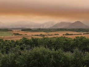 A large wild fire continues to burn in Waterton Lakes National Park, Alberta, on Tuesday, September 12, 2017. A Parks Canada official says a powerful wildfire that shut down Waterton Lakes National Park late last summer will inevitably change the species of birds in the area.