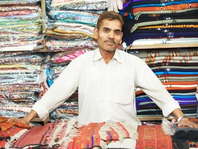 small shop owner indian man at his souvenir store