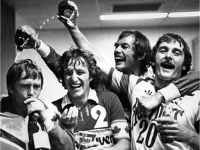 Whitecaps players Derek Possee, Ray Lewington, Peter Daniel and Bob Bolitho enjoy some bubbly after their Soccer Bowl championship final win over the Tampa Bay Rowdies on Sept. 8, 1979.