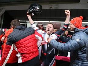 Justin Kripps celebrates his gold medal in the men's two-man bobsleigh at the Pyeongchang Olympics on Feb. 19.
