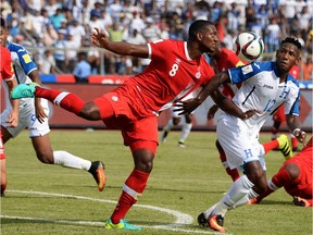 Doneil Henry (left) is almost balletic in Canada’s colours as he vies with Romell Quioto of Honduras for the ball during a FIFA World Cup qualifying match in San Pedro Sula, Honduras in September 2016.