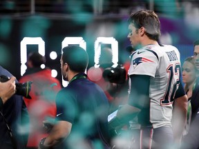 New England Patriots quarterback Tom Brady leaves the field after losing Super Bowl LII to the Philadelphia Eagles.