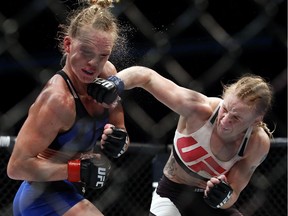 Valentina Shevchenko throws a punch during a women's bantamweight mixed martial arts bout in 2016.