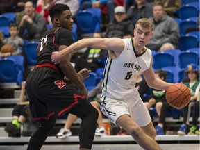 FILE PHOTO - Oak Bay Bays Cameron Henderson gets around  Brentwood College Somto Dimonachie in Vikes Alumni Senior Boys Invitational Tournament action at CARSA in Victoria, B.C. December  30, 2017.