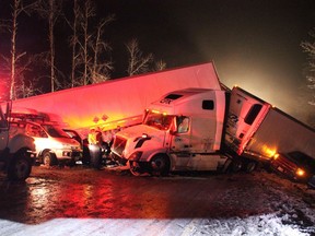 First responders and highway crews, shown here on Feb. 25, worked through the night east of Vancouver helping 165 victims involved in a multi-vehicle pileup on an icy stretch of the Coquihalla Highway.