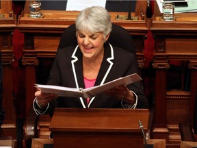 Finance Minister Carole James shares a laugh with a colleague before delivering the budget speech from the legislative assembly in Victoria last week.