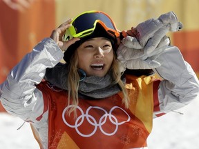 In this Tuesday, Feb. 13, 2018 file photo, Chloe Kim, of the United States, smiles during the women's halfpipe finals at Phoenix Snow Park at the 2018 Winter Olympics in Pyeongchang, South Korea. A San Francisco Bay Area radio station has fired one of its hosts, Patrick Connor, after he made sexual comments about 17-year-old Olympic snowboarder Kim on another station. Program director Jeremiah Crowe of KNBR-AM, where Connor hosted "The Shower Hour," confirmed the firing Wednesday, Feb. 14, 2018, for NBC Bay Area.