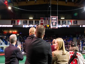 Former team captain Curtis Hodgson looks on with his family as the Vancouver Stealth retire his jersey on Saturday.