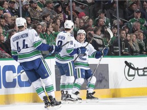 Vancouver Canucks' Darren Archibald takes a pre-game shot before a contest at Rogers Arena.