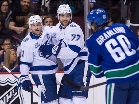 Tampa Bay Lightning's Victor Hedman, right, celebrates his goal against the Vancouver Canucks with teammate Steven Stamkos in Vancouver on Feb. 3, 2018.