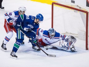 Bo Horvat is stopped by the Rangers' Henrik Lundqvist.
