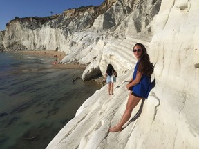 Katrin Sif Einarsdottir of Chilliwack poses on a cliffside in Sicily. After surpassing her goal of travelling to 200 countries by age 30, she has set a new goal of 240.