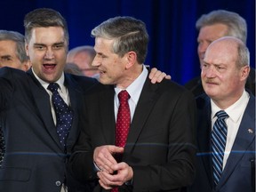 Party insiders: Former cabinet ministers all, Andrew Wilkinson, centre, is flanked by Todd Stone, left, and Mike de Jong, whom he defeated Saturday in the Liberal leadership race.