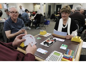 Bridge players at a Bridge Club that supports seniors which could be closing in Vancouver, BC.