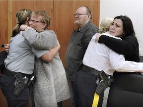 Friends and family members leave an RCMP press conference announcing charges against Ryan Lowe in the September 2017 fatal hit and run death of Laura Jeglum-Woycheshen.