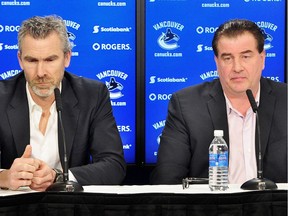 Director of hockey operations Trevor Linden talks to reporters in Vancouver on Wednesday after the Vancouver Canucks gave GM Jim Benning a contract extension.