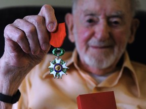 Robert Siddons shows the Legion of Honour medal he received from the French government.
