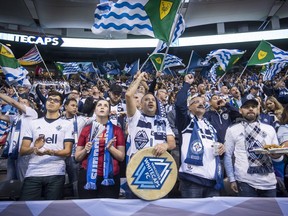 Vancouver Whitecaps fans cheer on the team before last year's MLS playoff game against the Seattle Sounders at B.C. Place, a full lower-bowl sellout.