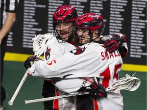 FILE PHOTO - Vancouver Stealth #18 Logan Schuss and #15 Corey Small celebrate Schuss's goal on the Georgia Swarm in the first half of a regular season NLL lacrosse game at LEC, Langley, January 27 2018.