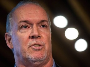 British Columbia Premier John Horgan announces changes to the province's minimum wage, at a coffee shop in North Vancouver, B.C., on Thursday February 8, 2018.