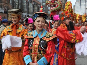 The annual Chinatown parade turns Pender Street into a festival of noise and colour in Vancouver on February 22, 2015.