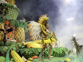 Dancers from the Rosas de Ouro samba school perform on a float during a carnival parade in Sao Paulo, Brazil, Saturday, Feb. 10, 2018.