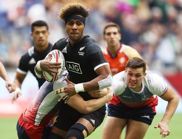 Luke Masirewa of New Zealand is tackled by Ivan Ovchinnikov of Russia during the Canada Sevens.