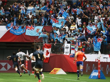 VANCOUVER, BC - MARCH 11: Fans cheer as Alasio Sovita Naduva of Fiji scores a try against Argentina during the Canada Sevens, the Sixth round of the HSBC Sevens World Series at the BC Place stadium Centre on March 11, 2018 in Vancouver, British Columbia, Canada.