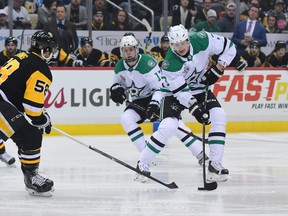 Dallas defenceman John Klingberg skates with the puck against the Pittsburgh Penguins at PPG PAINTS Arena on March 11, 2018.